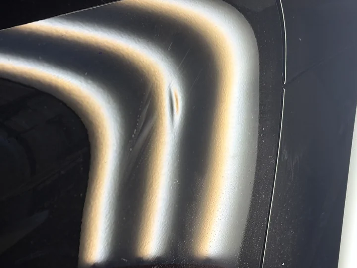 Porsche Macan dent repair — before